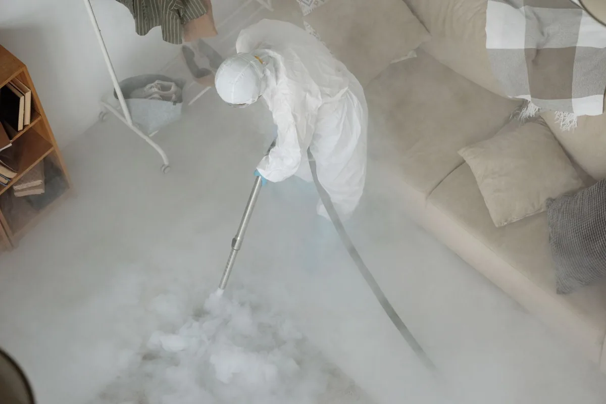 Biohazard cleanup technician in protective equipment, Granby, CO